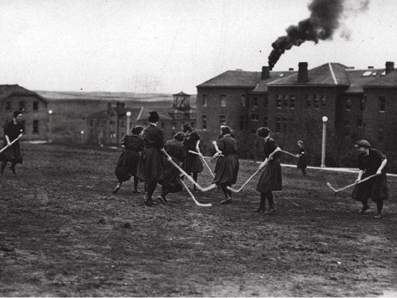 WSU Girls Playing with Ice Hockey Sticks on Grass - 1914